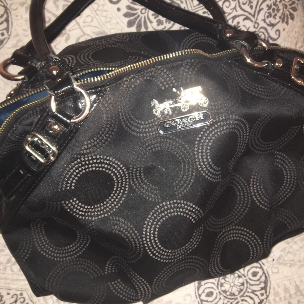 Black COACH bag with teal interior